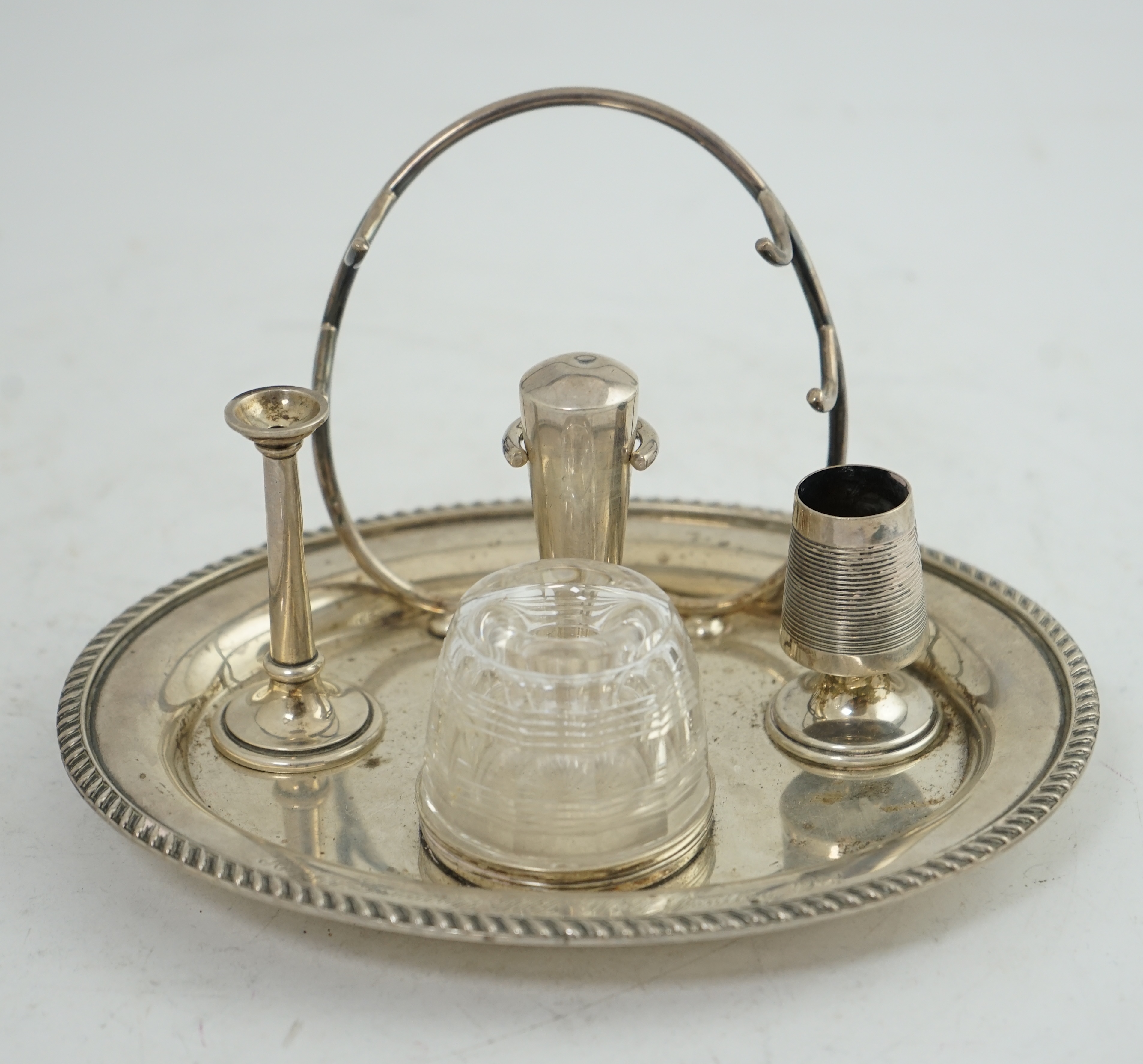 A late Victorian oval silver inkstand, with later RAF presentation inscription, maker Hukin & Heath